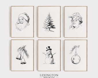 May include: Six framed black and white Christmas art prints. The prints feature Santa Claus, a Christmas tree, Mrs. Claus, bells, a snowman, and an ornament. The text "LEXINGTON PRINTS" is at the bottom.