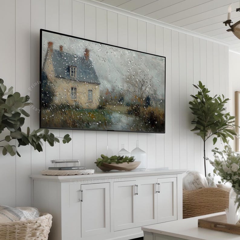 Vintage Spring Frame TV art for the Samsung Frame TV of a dark moody raining spring landscape as seen from the glass of a window. There are water droplets on the window. The artwork features neutral gray and brown tones. This Spring wall art decor is meant to be displayed in a Frame TV and it can also be used as farmhouse decor or cottagecore decor. The shop name Lexington Prints is listed below.
