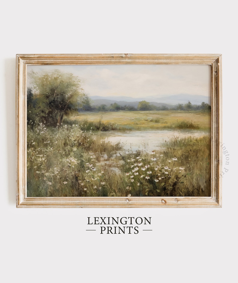 Vintage Spring wall art wildflower field art print landscape painting. It is displayed in an antique frame. This Spring decor can also be Easter decor. The painting features intricate brushwork and colors. The shop name Lexington Prints is written