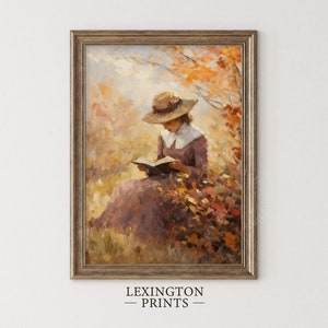 Vintage fall woman reading book fall painting oil painting art print displayed in an antique frame against a white background. The painting features intricate brushwork and colors. The shop name Lexington Prints is written out beneath the wall art.