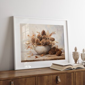Fall Vintage fall pinecone decor painting oil painting art print displayed in an antique frame against a white background. The painting features intricate brushwork and colors. The shop name Lexington Prints is written out beneath the wall art frame