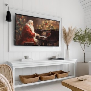 Vintage Christmas winter Santa Claus playing piano music art Frame TV art for Samsung Frame TV. This Christmas wall art decor is meant to be displayed in a Frame TV. The shop name Lexington Prints is listed below the frame where the art mockup is.