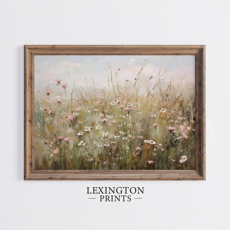 Vintage Spring wall art wildflower field landscape painting art print displayed in an antique frame, featuring pink and beige wildflowers up close. This Spring decor can also be Easter decor. The painting features intricate brushwork and colors. The shop name Lexington Prints is written below.