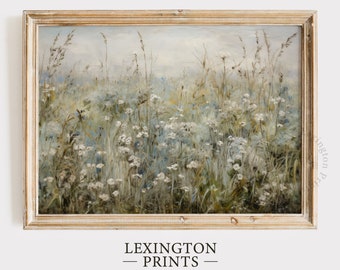 May include: A framed painting of a field of wildflowers in shades of blue, white, and green. The painting has a soft, dreamy feel and is perfect for adding a touch of nature to your home decor.