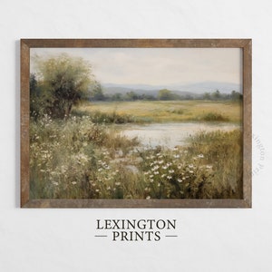 Vintage Spring wall art wildflower field art print landscape painting. It is displayed in an antique frame. This Spring decor can also be Easter decor. The painting features intricate brushwork and colors. The shop name Lexington Prints is written