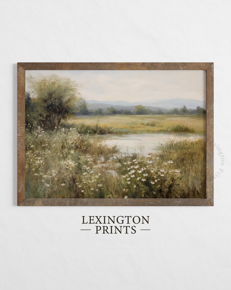 Vintage Spring wall art wildflower field art print landscape painting. It is displayed in an antique frame. This Spring decor can also be Easter decor. The painting features intricate brushwork and colors. The shop name Lexington Prints is written
