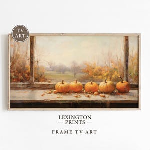 May include: A painting of a windowsill with five pumpkins on it. The pumpkins are orange and have a rustic look. The window is open and there is a view of a field and trees in the background. The painting is in a light wood frame.
