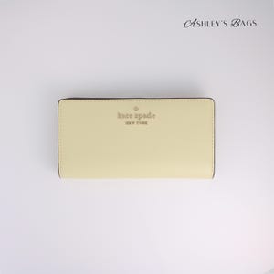 Kate Spade Staci Carteira grande e fina com duas dobras em tom limão