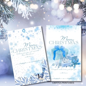 Peut inclure: Deux cartes de Noël avec des motifs bleus à l'aquarelle. L'une présente des flocons de neige et un oiseau, l'autre des cadeaux emballés. Les deux cartes ont le texte "Merry Christmas" et un message.