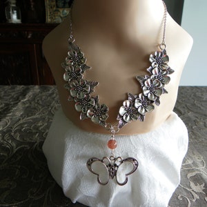 Silver flower necklace with butterfly pendant and strawberry quartz beads