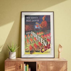 May include: A vintage poster with a red, white, and blue color scheme. The poster features a man in a pointed hat holding a small house. The text on the poster reads "Wir Konnen Nicht Zaubern Aber Arbeiten CDU Hilf Mit! Wahl Es Geht Um Deutschland!"