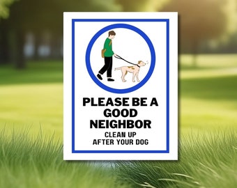 May include: White sign with a blue border and a cartoon illustration of a person walking a dog on a leash. The sign reads "Please be a good neighbour. Clean up after your dog."