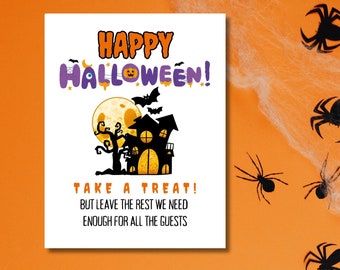 May include: A Halloween-themed sign with the words "HAPPY HALLOWEEN! TAKE A TREAT!" and a haunted house illustration. The background is orange with spiderwebs and black spider cutouts.