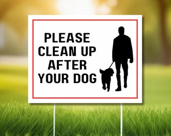 May include: White sign with a red border and black text that reads "Please clean up after your dog". A black silhouette of a person walking a dog is on the right side of the sign.