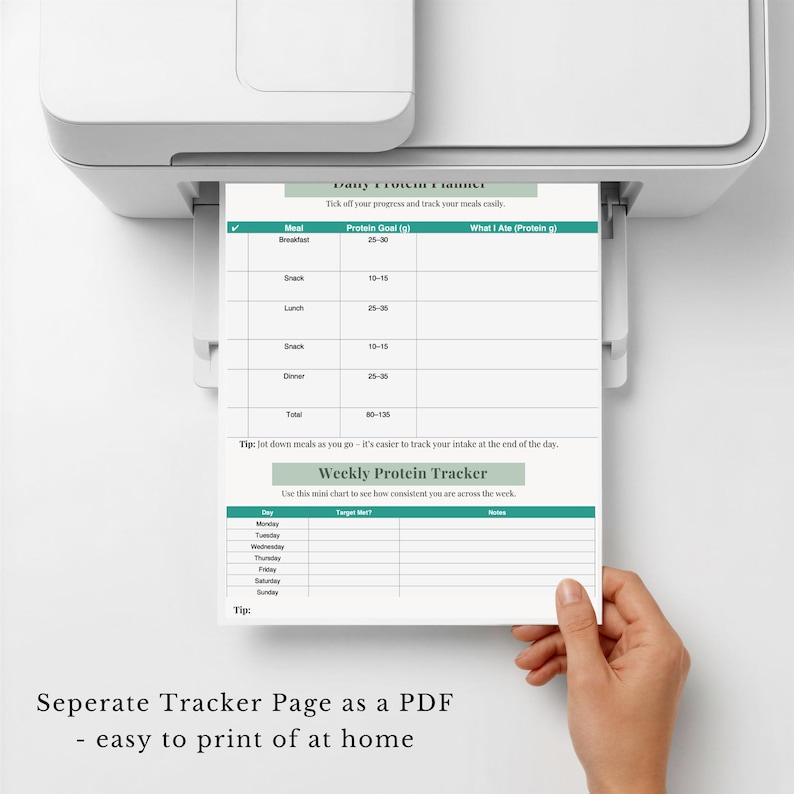 May include: A white printed paper document titled Daily Protein Planner and Weekly Protein Tracker featuring tables for tracking daily meals, protein goals, and weekly consistency, emerging from a white home printer.