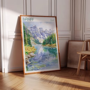 May include: A watercolor painting of a mountain lake scene in Banff, Canada. The painting features a turquoise lake surrounded by snow-capped mountains and lush green trees. The sky is a light blue with fluffy white clouds.