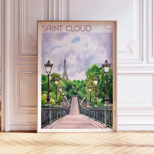 May include: A watercolour painting of a bridge in Saint Cloud, France. The bridge is lined with lampposts and leads to a view of a tower in the distance. The sky is a soft purple and the trees are green.
