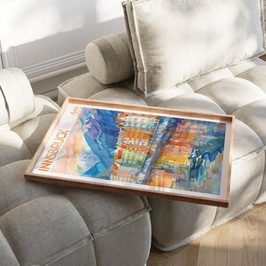 a picture of a couch with a painting on it