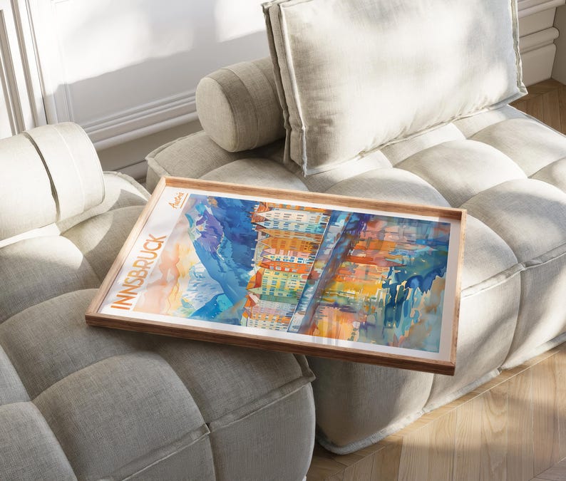 a picture of a couch with a painting on it