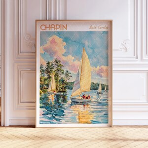 May include: A vintage travel poster featuring a watercolour illustration of sailboats on a lake with a blue sky and fluffy white clouds. The poster has the text "CHAPIN" and "South Carolina" in a gold font.