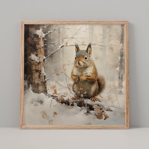 May include: A framed print featuring a watercolor painting of a squirrel in a snowy forest. The squirrel has brown and tan fur, with a fluffy tail and is perched on a snow-covered branch. The background shows bare trees and a soft, muted color palette.