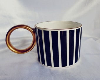 Handcrafted black and white ceramic coffee cup
