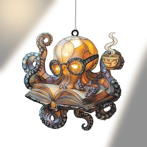 May include: A stained glass octopus in shades of brown, orange, and blue, wearing steampunk goggles and reading a book. It holds a cup of coffee, with steam rising. The octopus is suspended by a chain. The book is open.