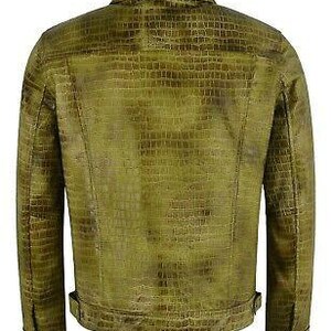 May include: A green leather jacket with a crocodile-embossed pattern. The jacket has a button-up collar, long sleeves, and a front zipper closure.