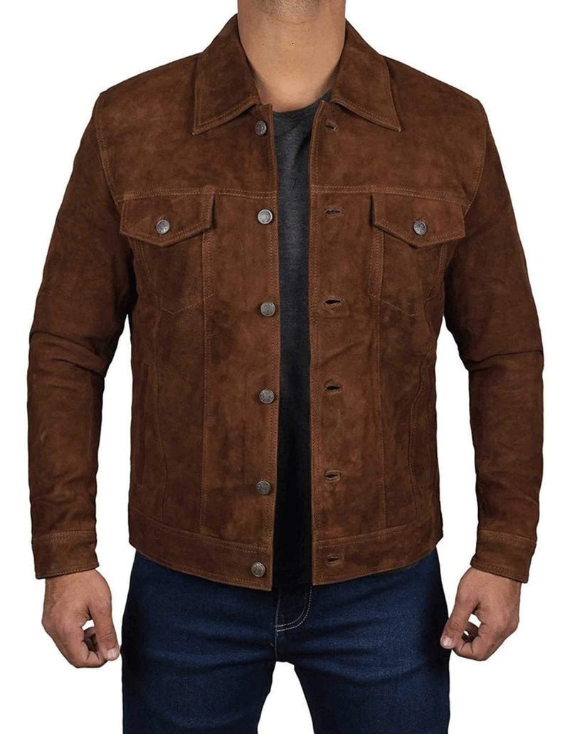 May include: A brown suede jacket with a button-up front and two flap pockets. The jacket has a classic denim style.