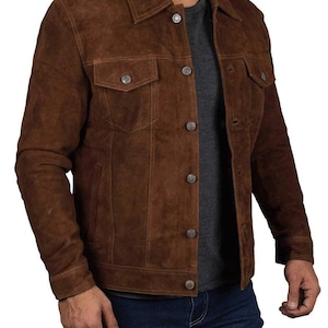 May include: A brown suede jacket with a button-up front and two flap pockets. The jacket has a classic denim style.