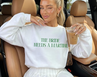 The Bride Needs a Martini Sweatshirt, viral bride shirt, pinterest aesthetic bachelorette top, wedding after party shirt, gift for bride