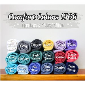 May include: Comfort Colors 1566 Crewneck Sweatshirt in a variety of colors, including white, grey, pepper, butter, orchid, violet, chalky mint, seafoam, light green, blue spruce, crimson, water melon, lagoon blue, cham bray, flo blue, blue jean, denim, and true navy.