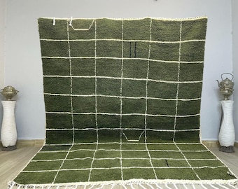May include: A green and white checkered rug with a fringe border. The rug is made of wool and has a soft, plush texture.