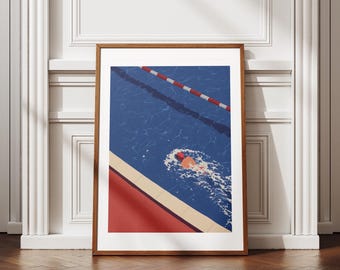 May include: A framed art print depicts a swimmer in a blue pool with red and white lane markers. The artwork features a red pool deck and a swimmer wearing a red cap. The print is displayed in a wooden frame.