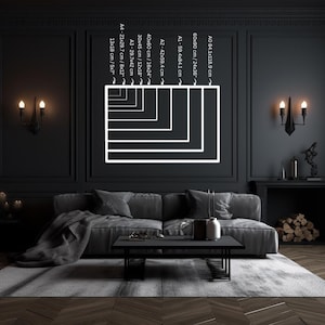May include: A black and white illustration of different sizes of paper or poster frames on a black wall. The frames are labeled with their dimensions in centimeters and inches.