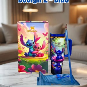 May include: A blue Stanley tumbler and accessories set featuring a cartoon character design. The set includes a tumbler, a box, a straw, and a straw topper. The box and tumbler have a colorful illustration of the character. The text "Design 2 - Blue" is at the top.