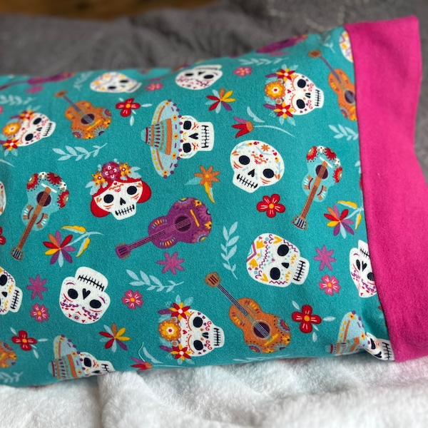 Dia de los muertos flannel fabric with pink cuff. Travel or children's pillow case. Goes with 12" x 16" pillow, available separately.