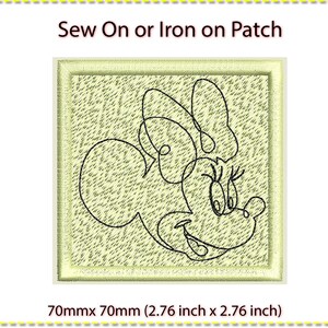 May include: Sew-on or iron-on patch featuring a black outline of a cartoon mouse head with a single large ear and a closed eye. The patch is 70mm by 70mm and has a light green background.