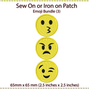 May include: Set of three yellow iron-on or sew-on patches featuring different emoji faces. The emojis are a winking face, a kissing face, and an angry face. Each patch is 6.5 cm by 6.5 cm.