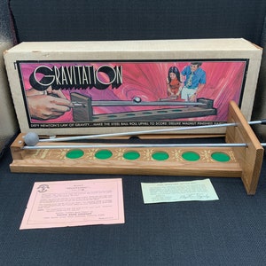 Vintage zwaartekrachtspel uit de jaren 70, klassiek bordspel, retro familiespel, nostalgisch entertainment, collector&#39;s item, vintage bordspel