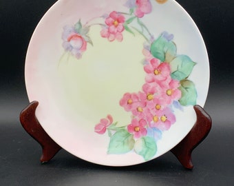 Plato Nippon vintage, porcelana antigua rosa con estampado floral, decoración coleccionable para el hogar.