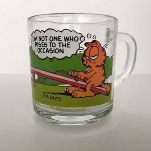 Vintage McDonald&#39;s 1980 Garfield & Odie &quot;A la altura de la ocasión&quot; Taza de vidrio