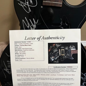 Keith Urban and others autograph guitar