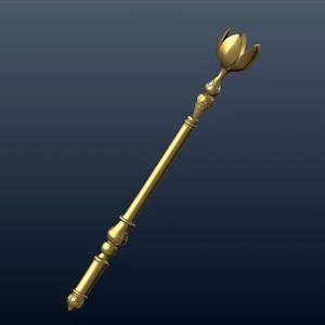Peut inclure: Un sceptre doré avec un sommet décoratif en forme de fleur. Le sceptre a un long manche mince et une poignée détaillée.