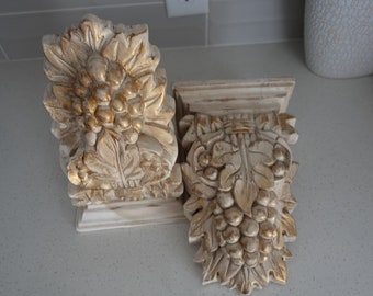 Vintage sconces made out of wood in cream color and gold accents