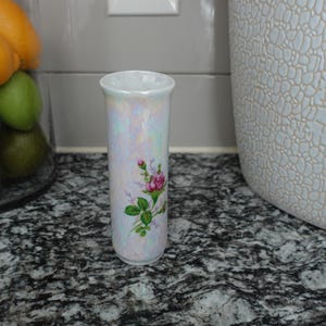 Iridescent bud vase with floral decorations