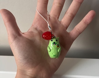 Cachorro alienígena con llavero de piruleta