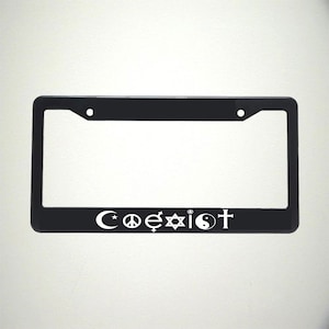 May include: Black plastic license plate frame with white symbols representing different religions and the word "Coexist" printed on the bottom.