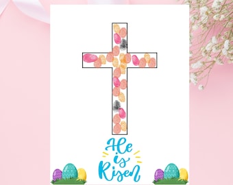 May include: A printable Easter card featuring a cross made of colourful eggs and the text "He is Risen".