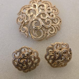Goldtone Trifari brooch and earrings set